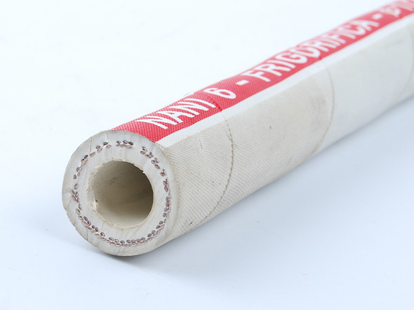 A food grade rubber hose with a red label